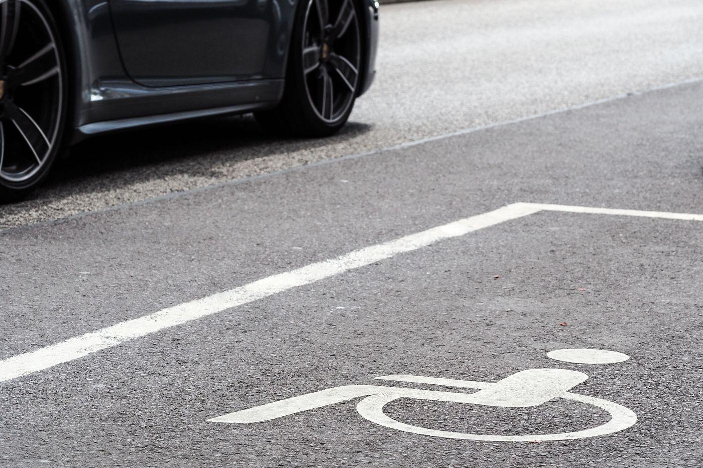 An accessible parking space marked with the wheelchair symbol
